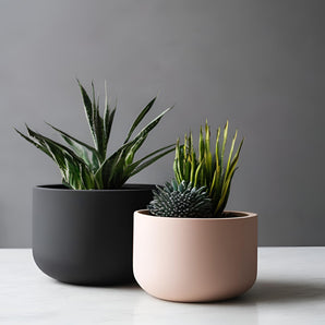 Minimalistisk rund plantepotte i moderne design