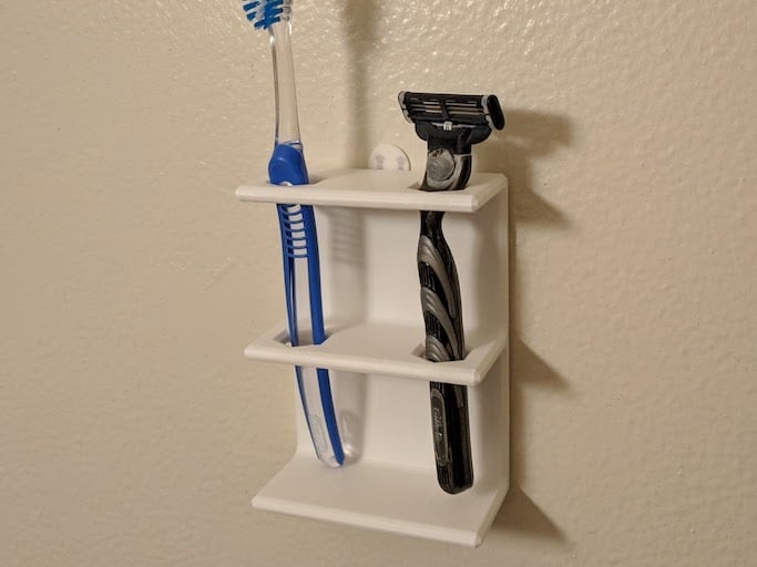 Στήριγμα τοίχου για οδοντόβουρτσα ή ξυριστική μηχανή