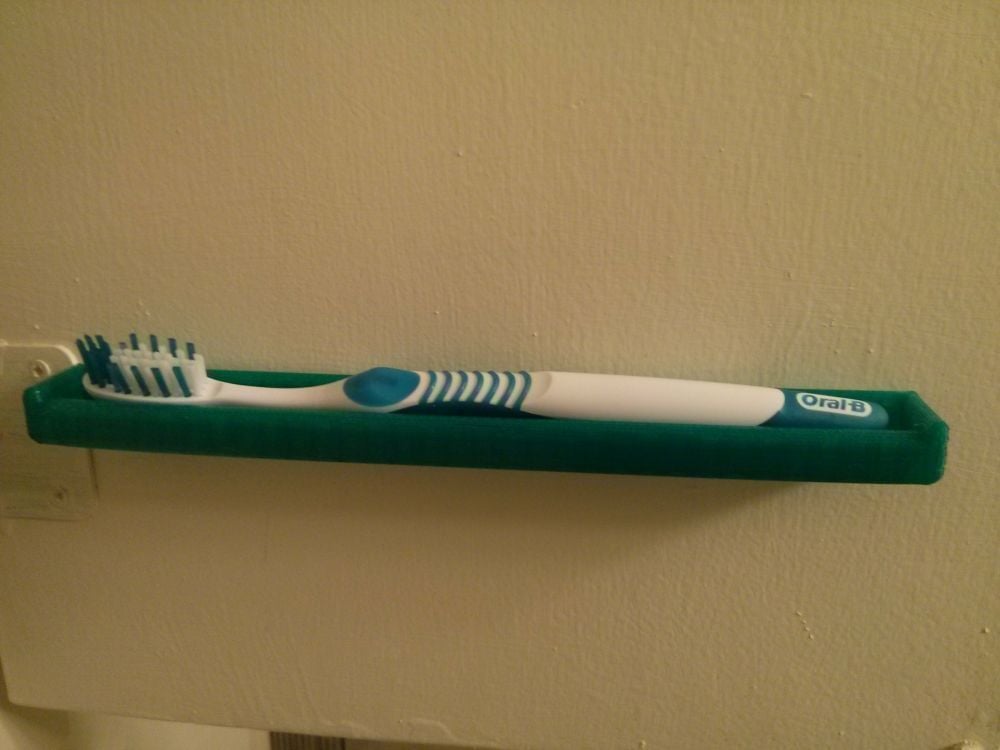 Στήριγμα οδοντόβουρτσας που εξοικονομεί χώρο